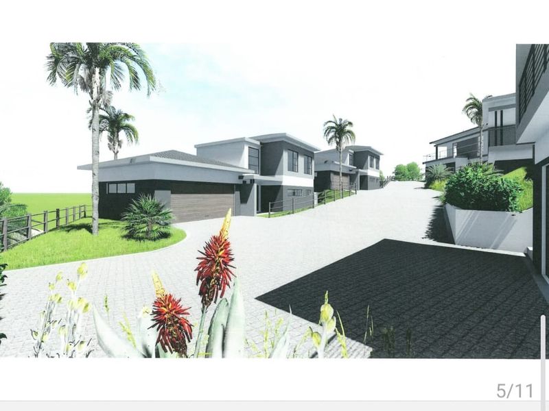 A digital architectural rendering showing the front elevation and paved driveway access for a modern townhouse development.