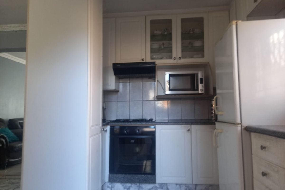 This welcoming investment property with three specious tiled bedrooms in the very big stand - Photo 4