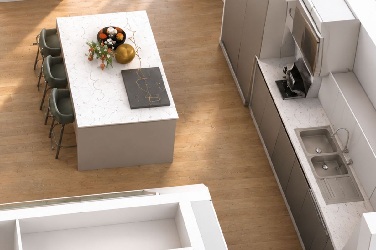 Modern kitchen featuring a central island with quartz countertops, sleek cabinetry, and a double bowl sink, set against light wood-look flooring.