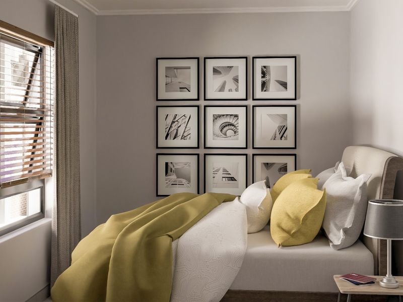 A well-lit bedroom featuring neutral wall tones, a window with venetian blinds, and a clean, modern aesthetic.