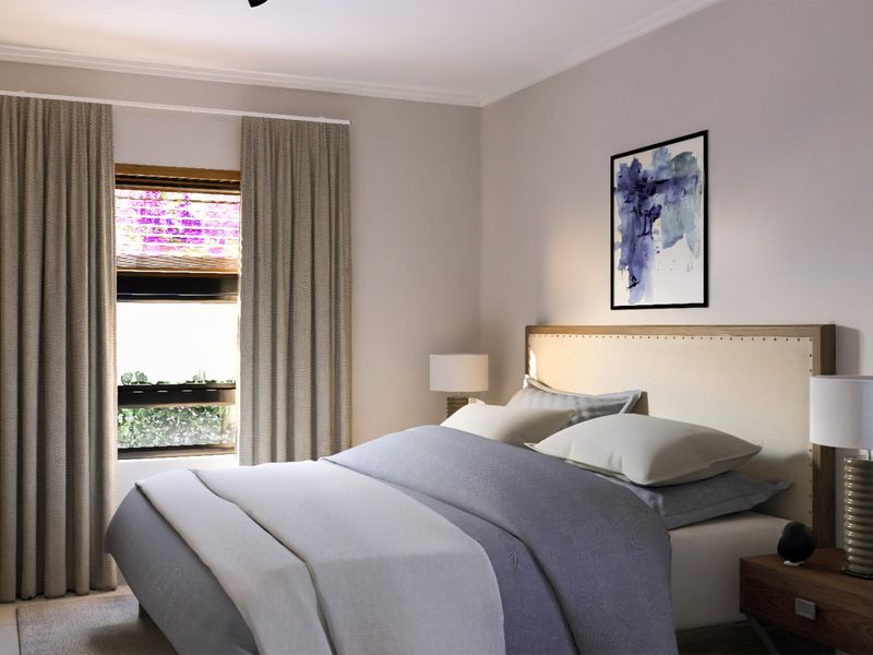 A well-maintained bedroom featuring neutral wall tones, coving, and a window with curtains, creating a comfortable and inviting sleeping space.