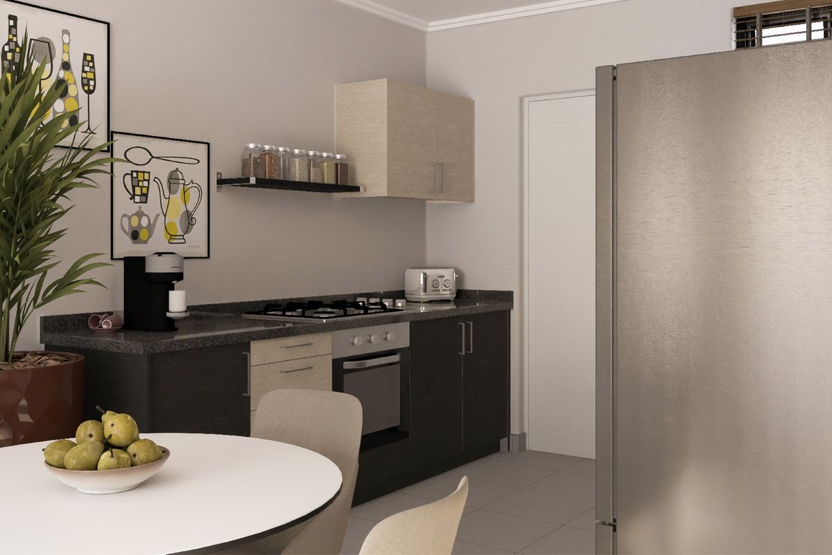 A compact, modern kitchen featuring dark and light wood-tone cabinetry, a gas cooktop, built-in oven, and neutral tiled flooring.