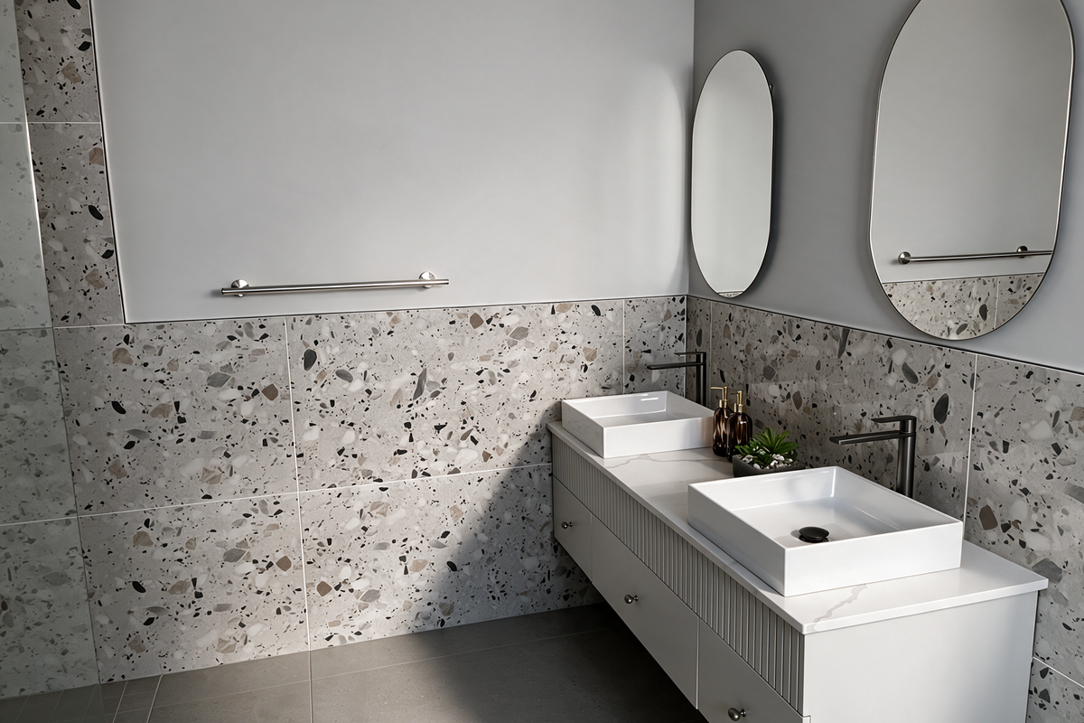 Modern bathroom featuring a double vanity with vessel sinks, contemporary wall-mounted faucets, and stylish terrazzo wall tiling.