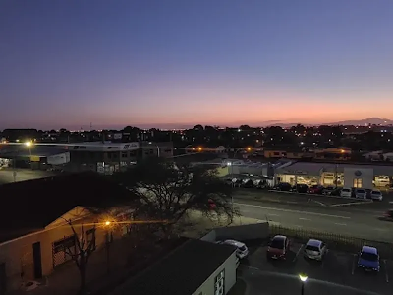 Elevated evening view overlooking the surrounding urban landscape and street infrastructure.
