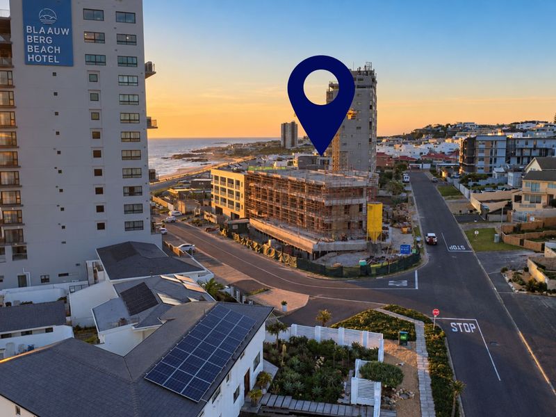 Aerial view of the coastal neighborhood showing the property location, surrounding infrastructure, and proximity to the beach and local hotel.