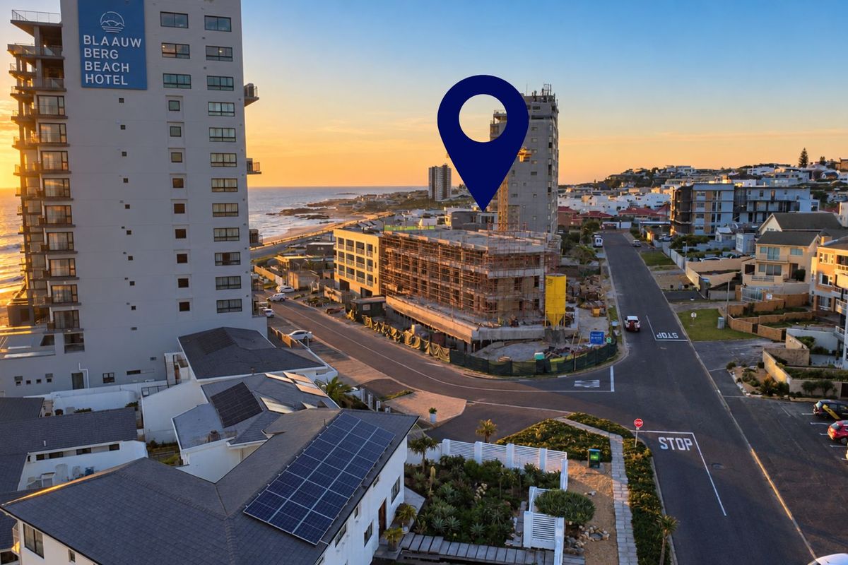 Aerial view of the coastal neighborhood showing the property location, surrounding infrastructure, and proximity to the beach and local hotel.