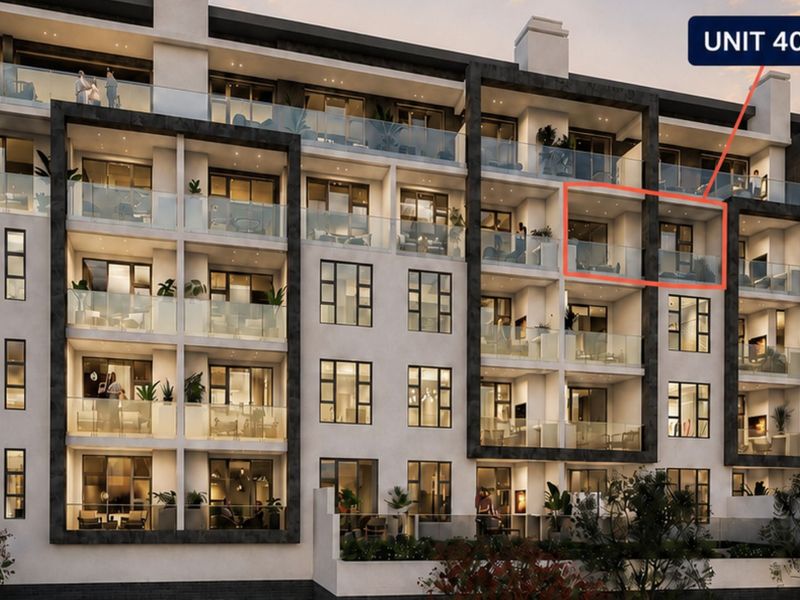 A modern apartment building exterior featuring glass-fronted balconies and contemporary architectural design, highlighting the location of Unit 404.