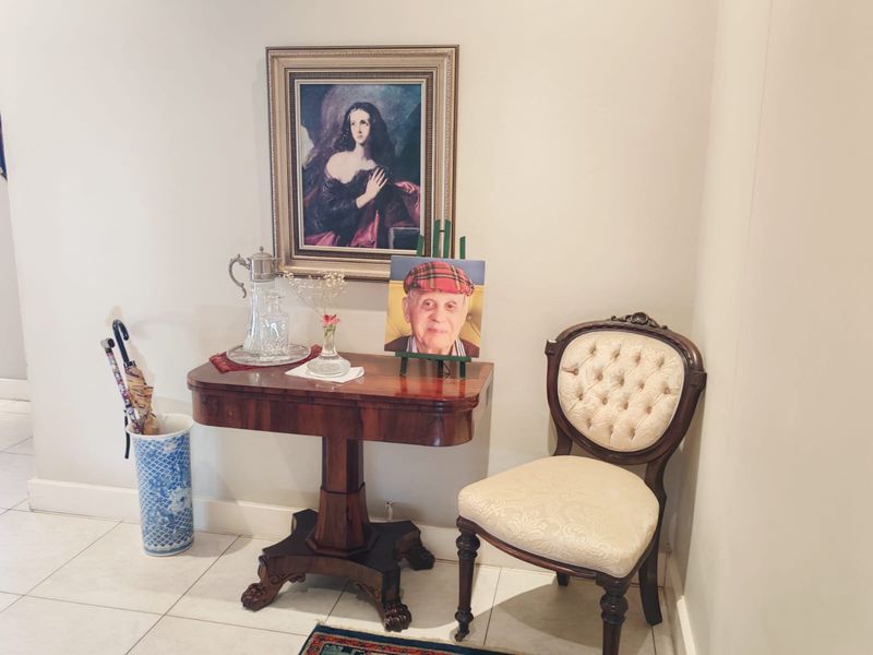A well-maintained entryway featuring neutral tiled flooring and clean wall finishes, providing a welcoming transition space within the apartment.
