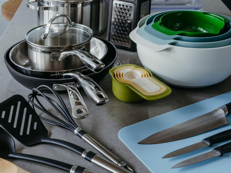 A close-up view of a modern kitchen countertop featuring a stone surface, showcasing a clean and functional food preparation area.