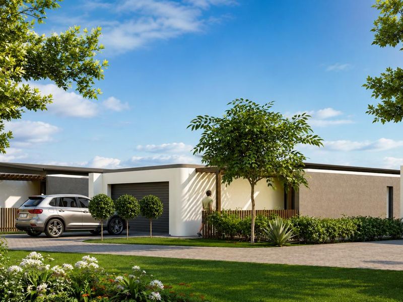 Modern townhouse exterior featuring a paved driveway, integrated garage, and landscaped garden with timber pergola accents.