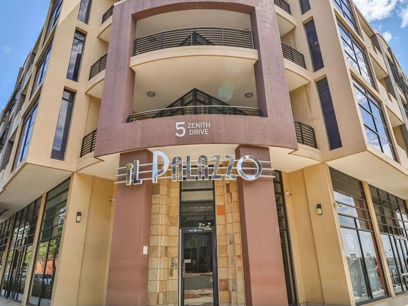 Front elevation of the Il Palazzo apartment complex at 5 Zenith Drive, featuring modern architectural design with glass facades and stone cladding.