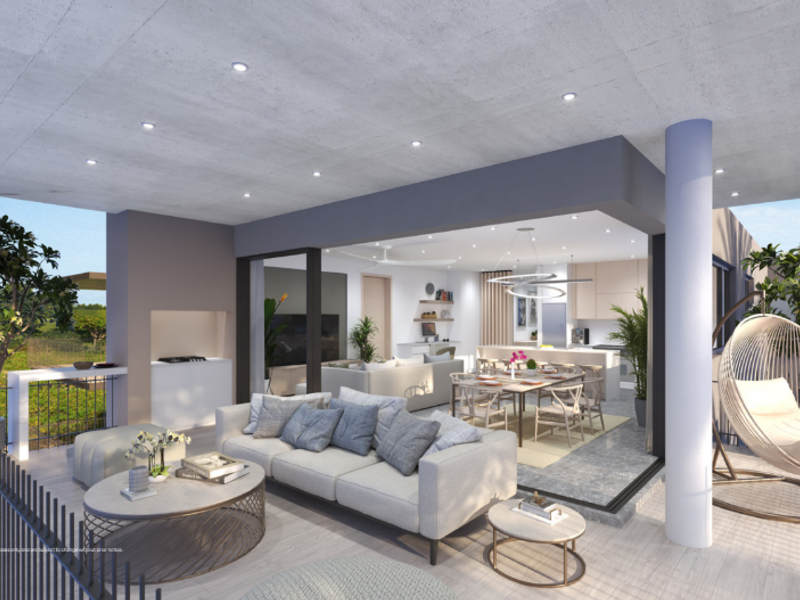 Spacious covered balcony featuring a built-in outdoor braai, recessed lighting, and seamless flow into the open-plan interior living and dining area.