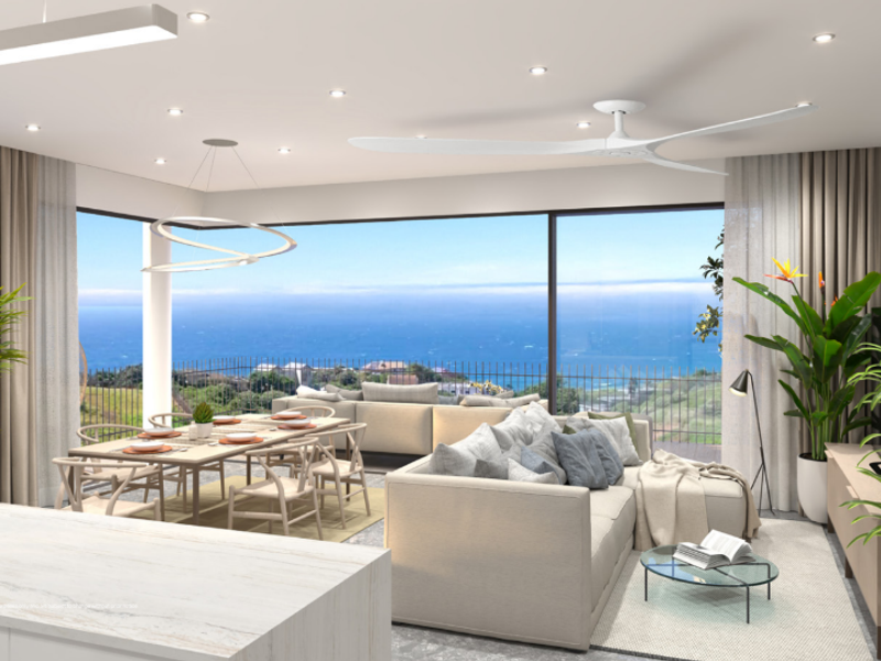 A modern open-plan living and dining area featuring floor-to-ceiling sliding glass doors with expansive ocean views and high-end contemporary finishes.