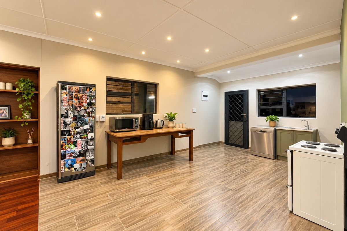 A functional kitchen featuring tiled flooring, recessed lighting, built-in shelving, and essential appliances including a stove and dishwasher.