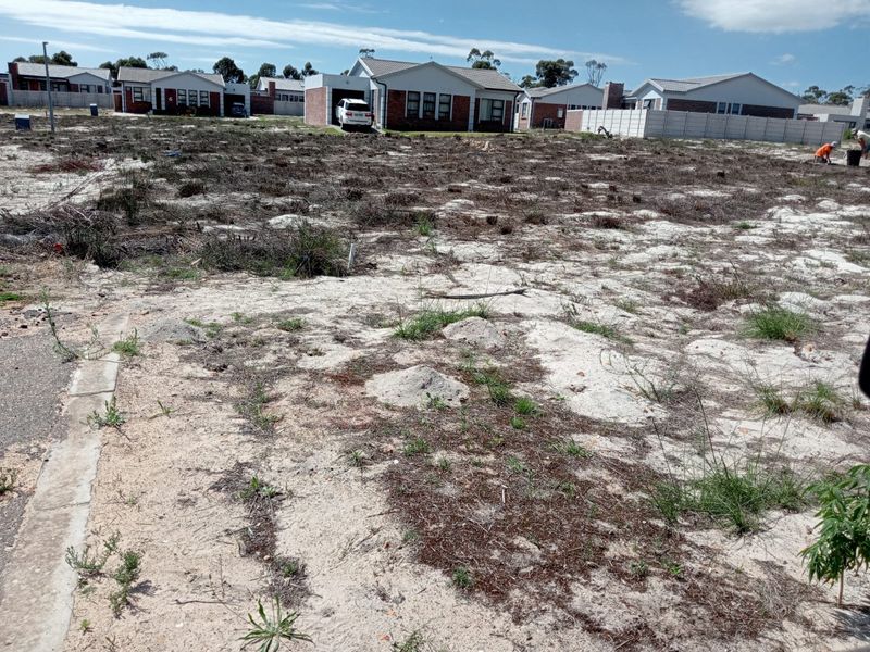A vacant residential plot of land situated in a developed neighborhood, ready for new construction.