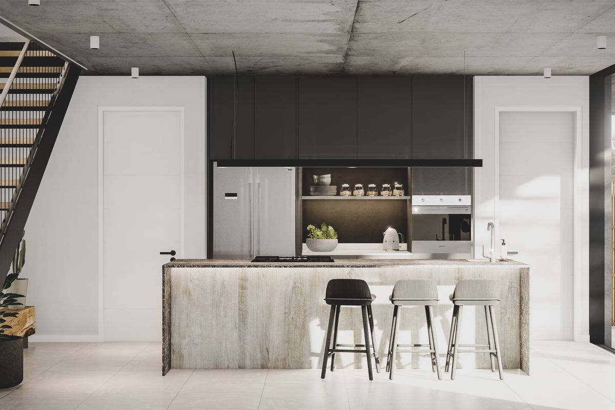 Modern open-plan kitchen featuring a stone-clad island, integrated appliances, sleek dark cabinetry, and an exposed concrete ceiling, adjacent to a contemporary staircase.
