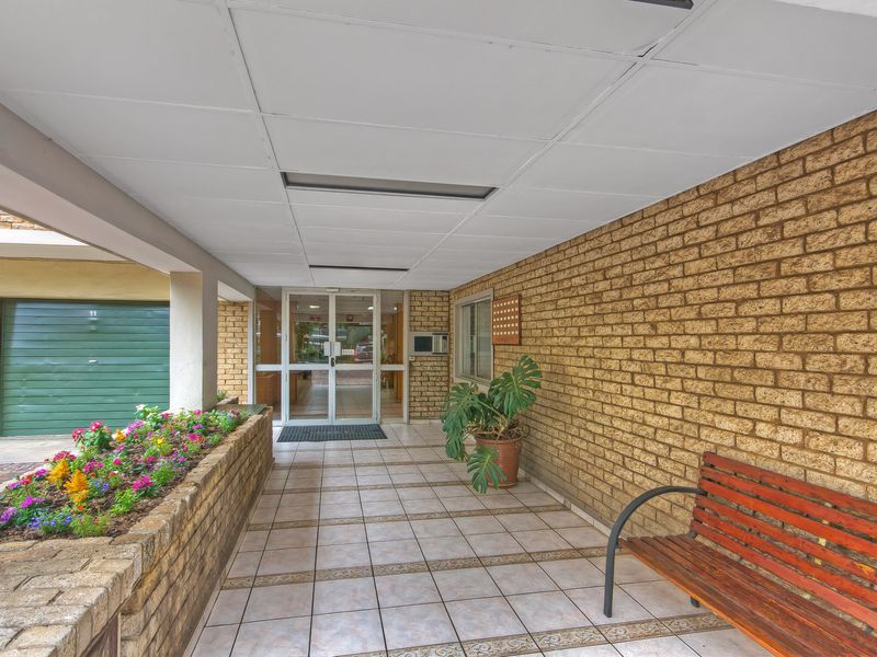 PRICED TO SELL IN A SECURE COMPLEX AND WELL MAINTAINED - Photo 1