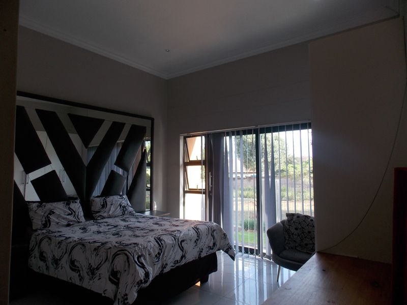 Sleek & Modern Family Living in Leloko Lifestyle Estate with Pool & Entertainer’s Patio - Photo 9