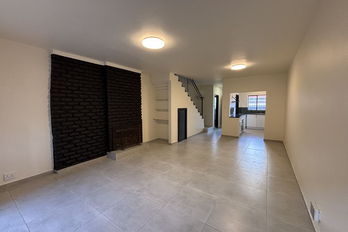 Modern, Move-In Ready Townhouse with Private Garden in Secure Complex - Photo 2