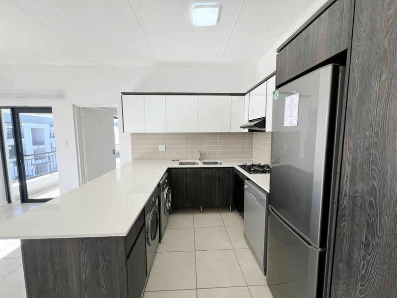 Top-Floor Luxury Living with Sunshine, Style & Unmatched Lifestyle Convenience - Photo 3