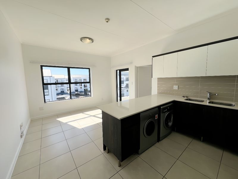 Top-Floor Luxury Living with Sunshine, Style & Unmatched Lifestyle Convenience - Photo 2