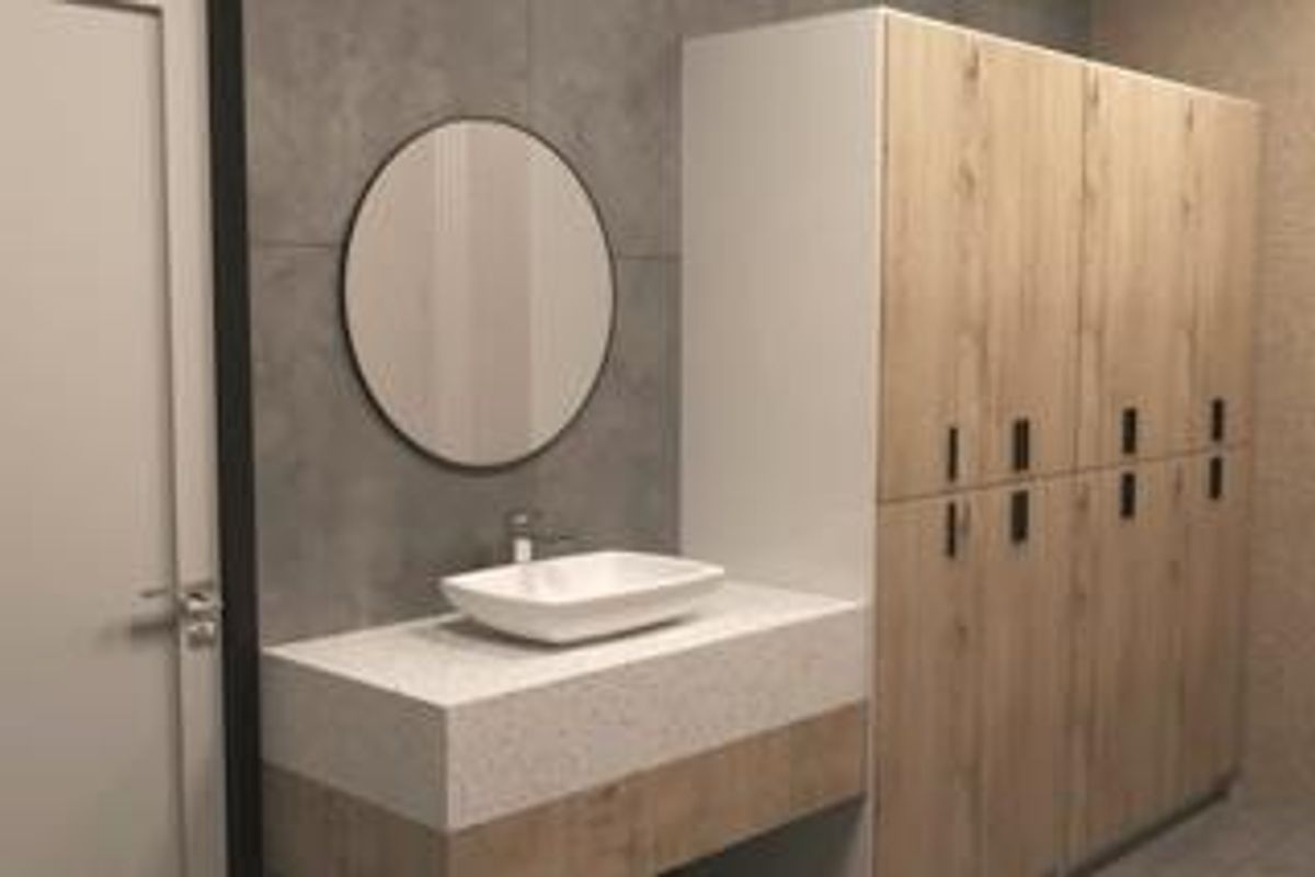 Modern bathroom featuring a vessel sink, stone-look vanity, circular mirror, and floor-to-ceiling wood-finish cabinetry.
