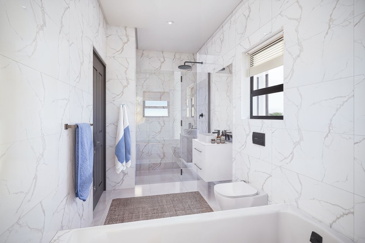 Modern bathroom featuring marble-look wall tiles, a walk-in shower with glass screen, wall-mounted vanity with vessel sink, and a wall-hung toilet.