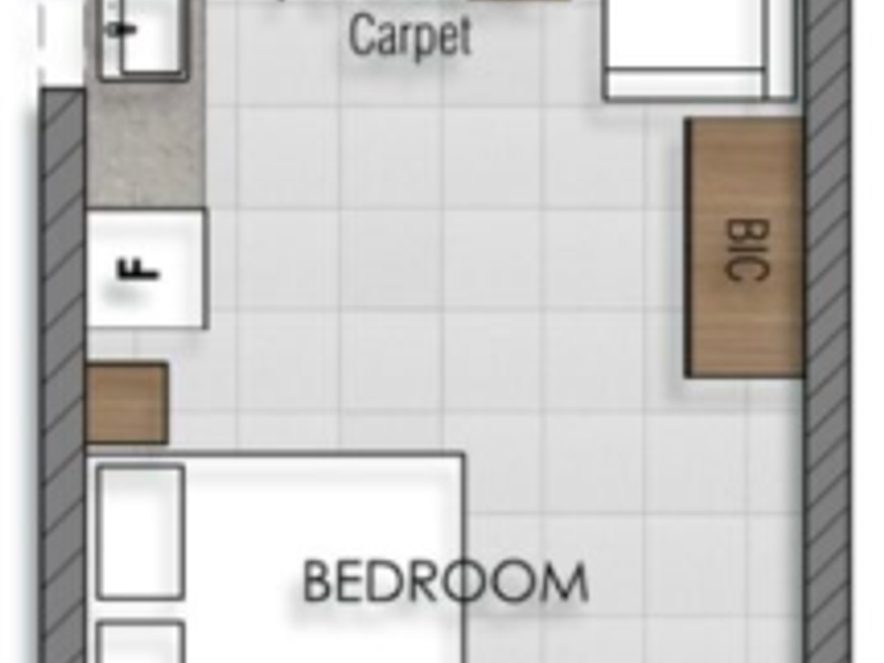 A clear architectural floor plan showing the layout of a studio apartment including a kitchenette, lounge area, bedroom, and bathroom.