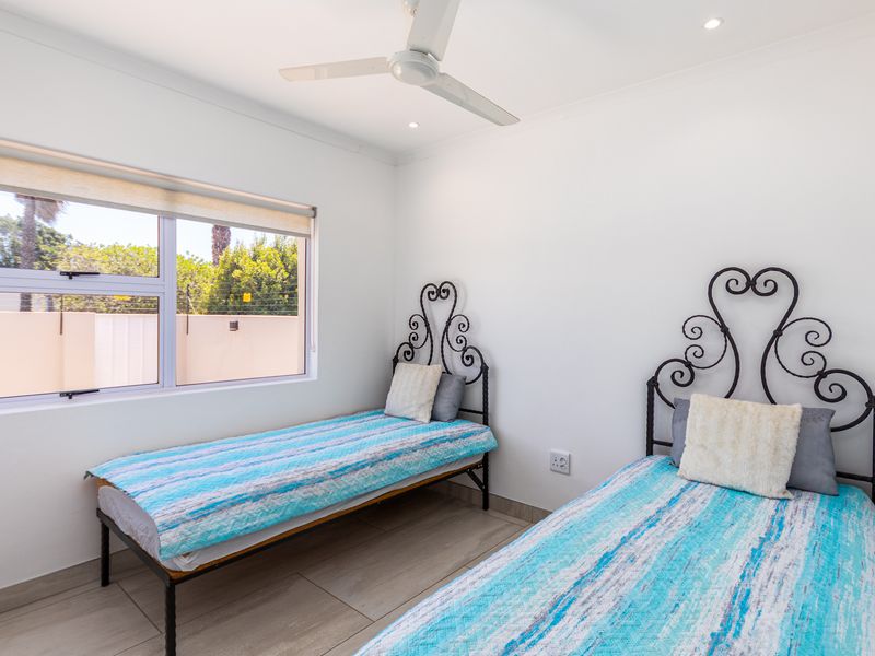 Beautifully Renovated 4-Bedroom Family Home with Pool, Security & Exceptional Outdoor Living - Photo 9