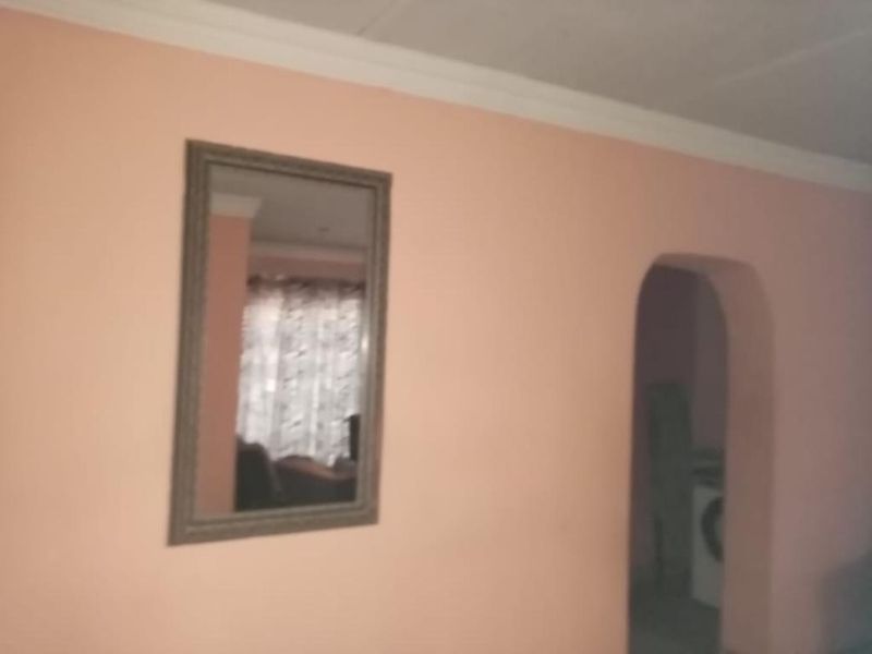 This beautiful three bedrooms property its situated in Soshanguve Block P - Photo 2