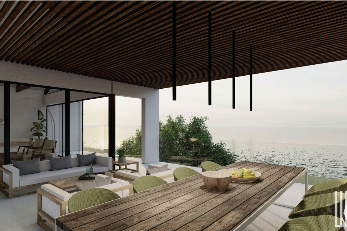A modern covered patio featuring a slatted timber ceiling, glass balustrade, and expansive ocean views, perfect for outdoor dining and relaxation.