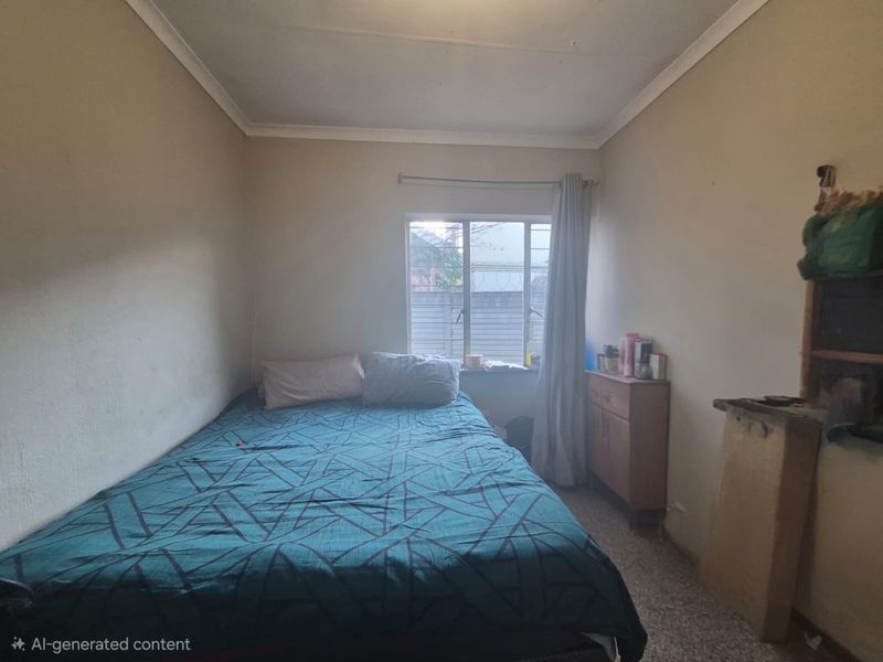 A compact bedroom featuring a window with a curtain rail and coving, requiring cosmetic updates to improve the overall finish and appeal.