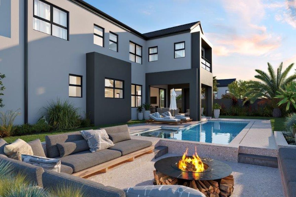 Rear exterior view of a modern cluster home featuring a swimming pool, sunken fire pit area, and a landscaped garden.