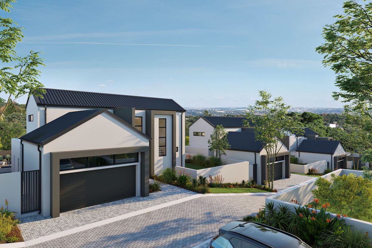 A modern cluster development featuring contemporary architectural design, paved driveways, and landscaped gardens in a secure residential setting.