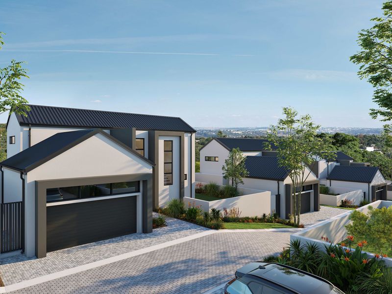 A modern cluster development featuring contemporary architectural design, paved driveways, and landscaped gardens in a secure residential setting.