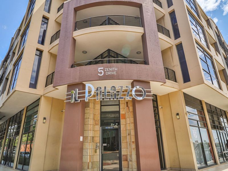 Exterior view of the Il Palazzo apartment building at 5 Zenith Drive, featuring modern architectural design with glass facades and private balconies.