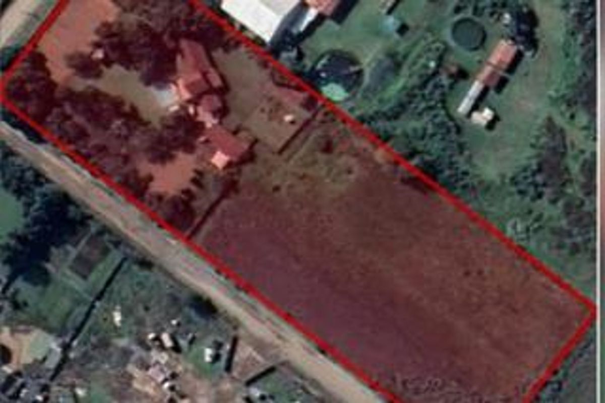 Aerial view of the small holding property showing the main dwelling, outbuildings, and surrounding land boundaries.