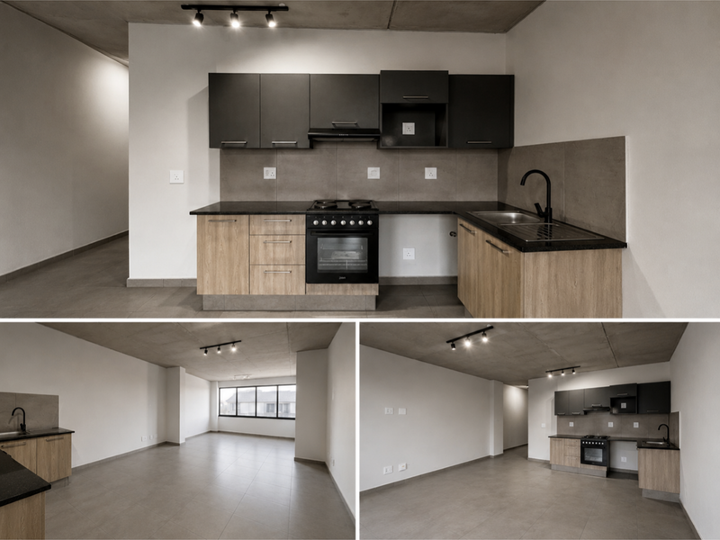 A modern open-plan apartment living area featuring a contemporary kitchen with dark upper cabinets, wood-finish lower cabinetry, and exposed concrete ceilings.