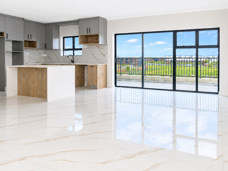 Modern open-plan living area featuring high-gloss marble-look floor tiles, a contemporary two-tone kitchen with an island, and large sliding doors leading to a balcony.