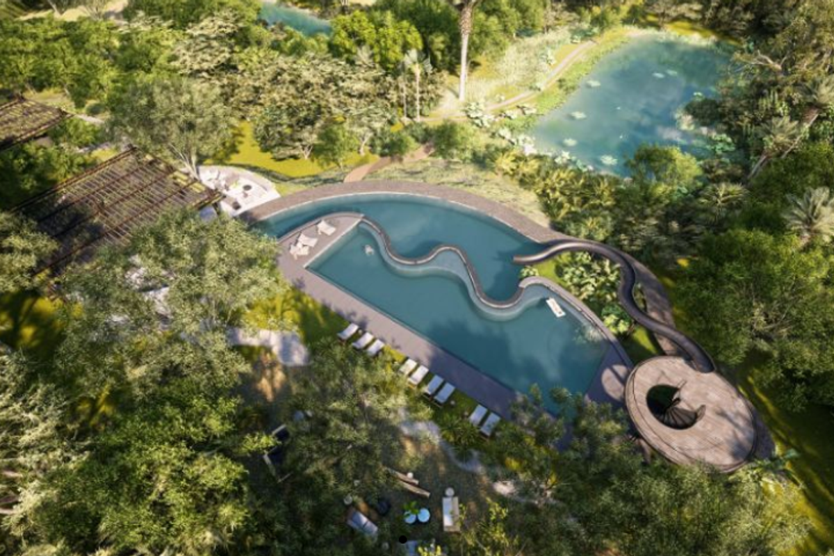 Aerial view of a luxury residential property featuring a large swimming pool with a water slide, pergola, and landscaped garden surroundings.