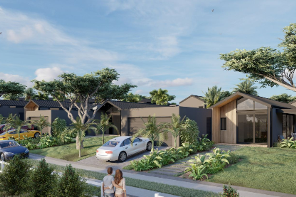 A modern residential street view featuring contemporary homes with pitched roofs, paved driveways, and landscaped gardens in a well-planned estate setting.