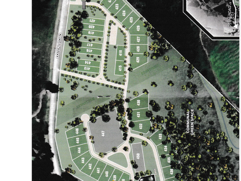 A detailed site development plan showing the layout of residential plots, internal roads, and communal green spaces within the estate.