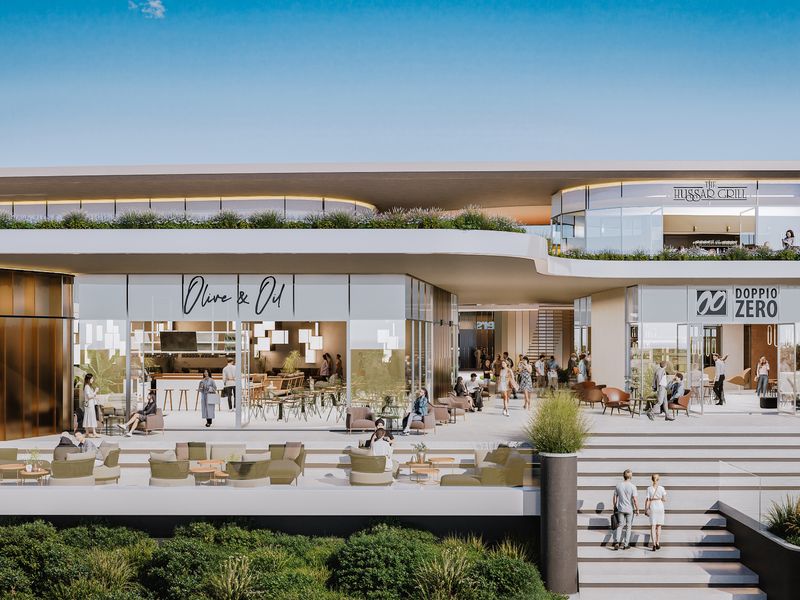 A modern commercial development featuring Zimbali Square with multiple restaurant storefronts, expansive terraced outdoor seating, and contemporary architectural design.