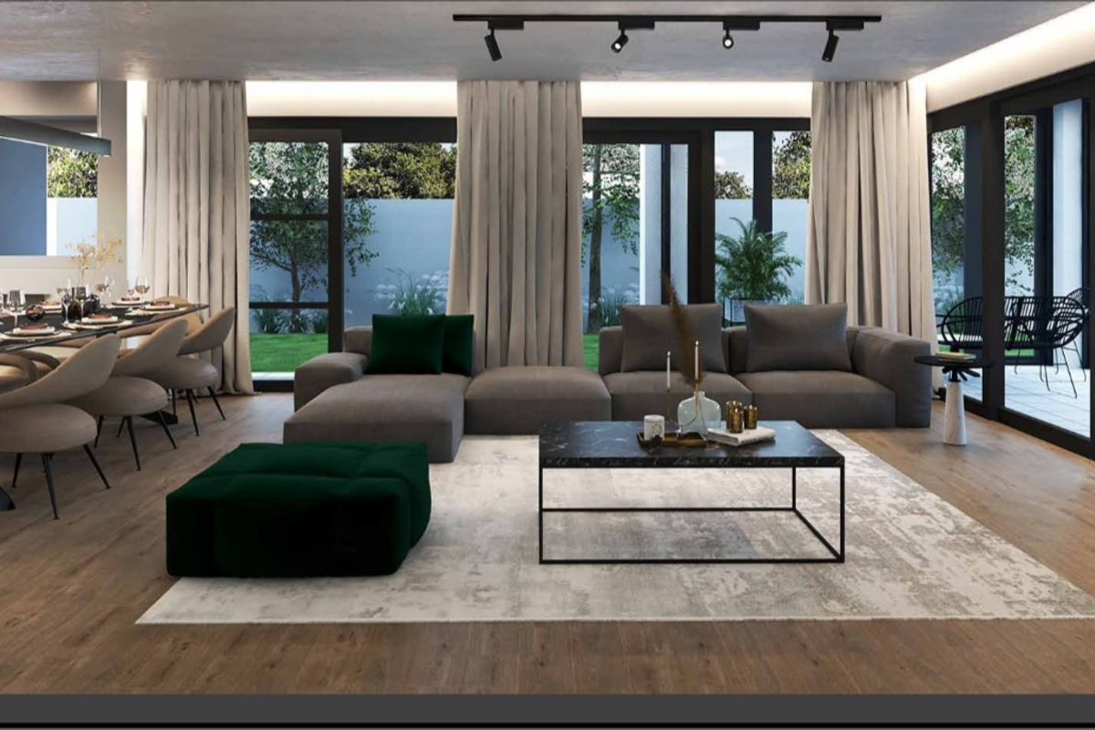 Spacious open-plan living and dining area featuring modern track lighting, high-quality laminate flooring, and large sliding glass doors opening to the garden.