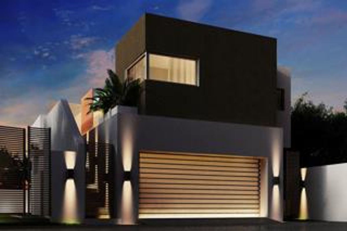 Modern cluster home exterior featuring a sleek facade, automated garage door, and contemporary architectural lighting at dusk.
