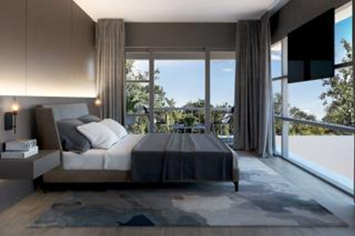 Modern bedroom featuring floor-to-ceiling windows, recessed wall lighting, and direct access to a private balcony with scenic views.