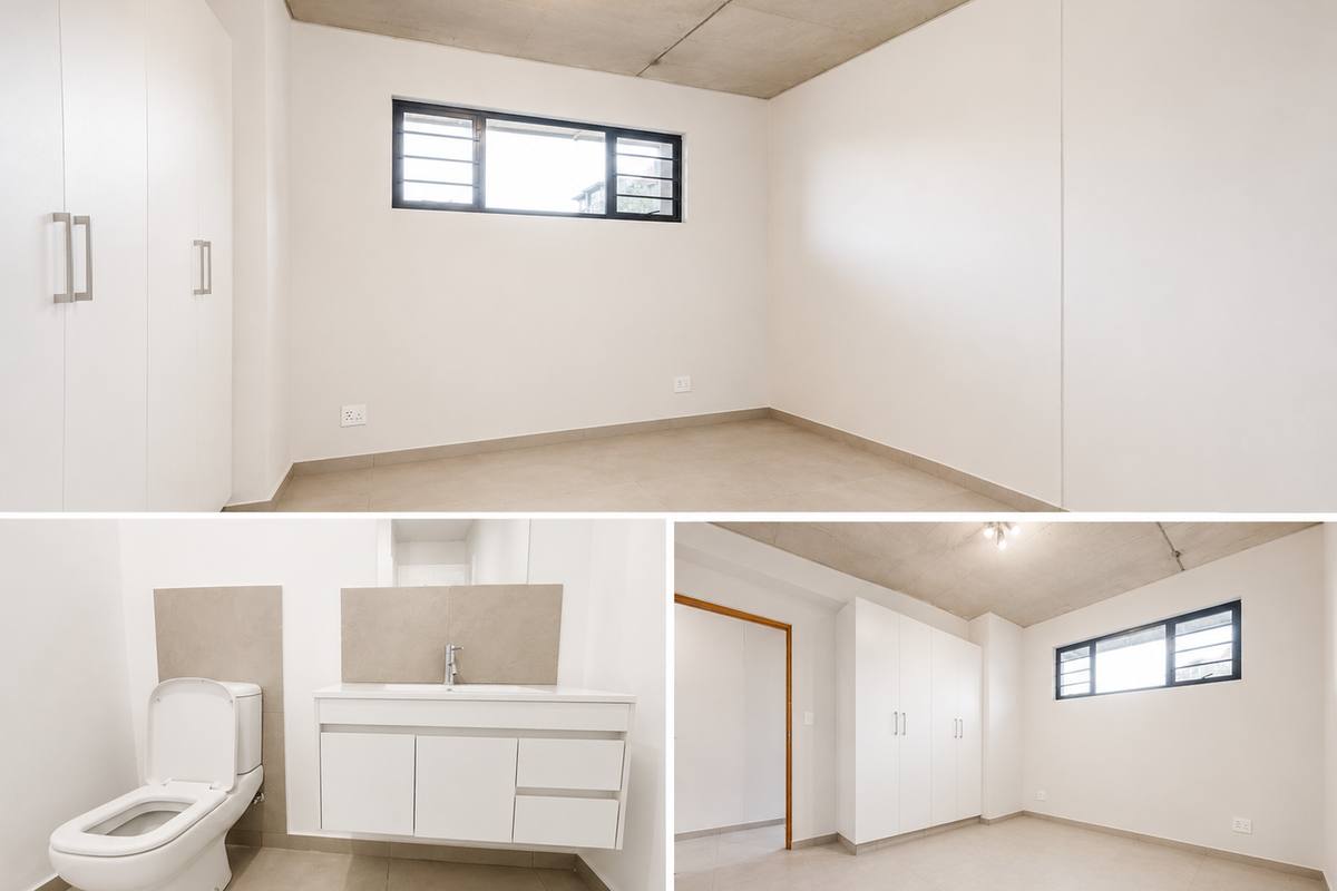 A bright, modern bedroom featuring built-in cupboards, tiled flooring, and an exposed concrete ceiling, offering a clean and minimalist living space.