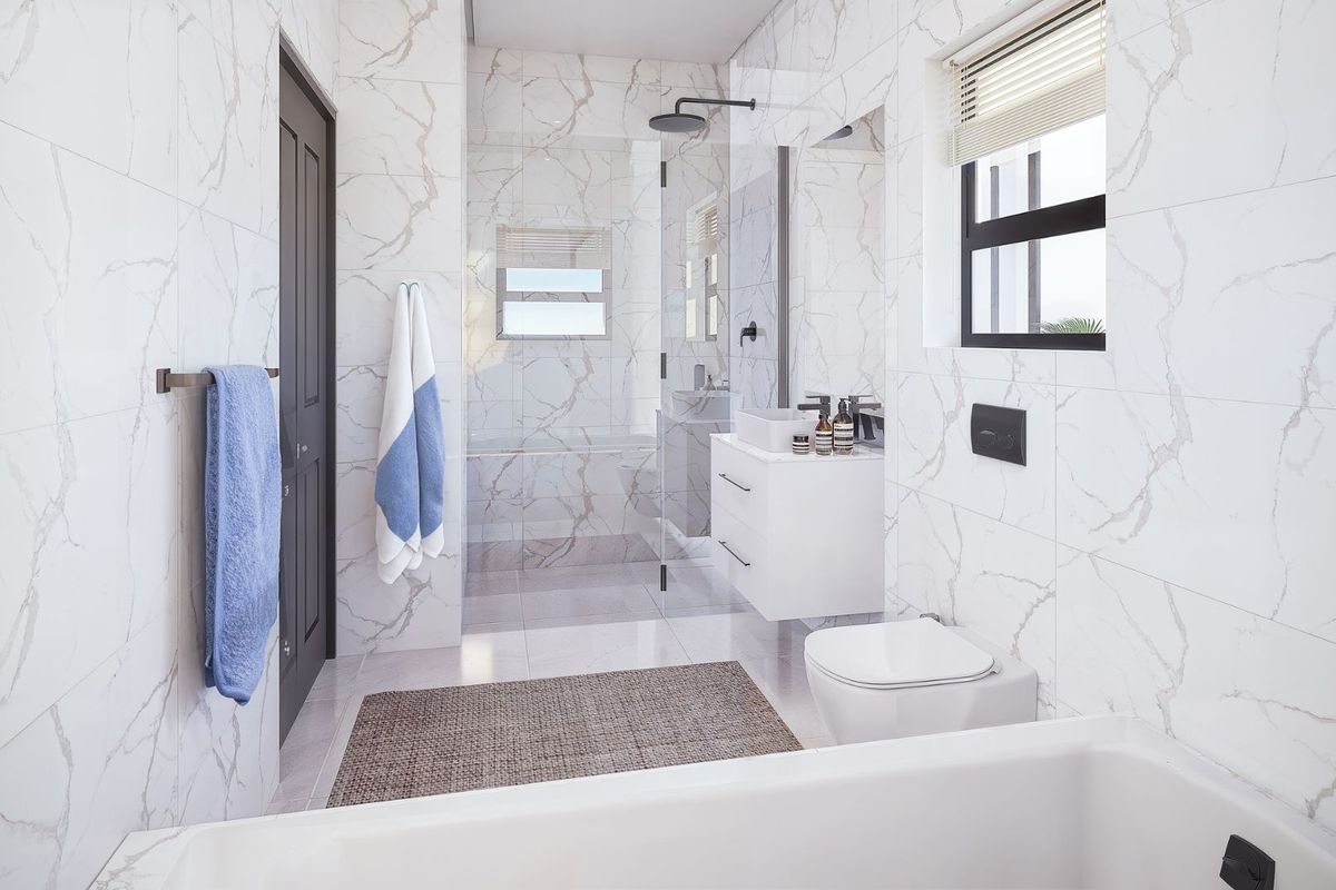 Modern bathroom featuring marble-look wall tiles, a wall-hung vanity with vessel sink, wall-mounted toilet, and a spacious glass-enclosed shower with black fixtures.