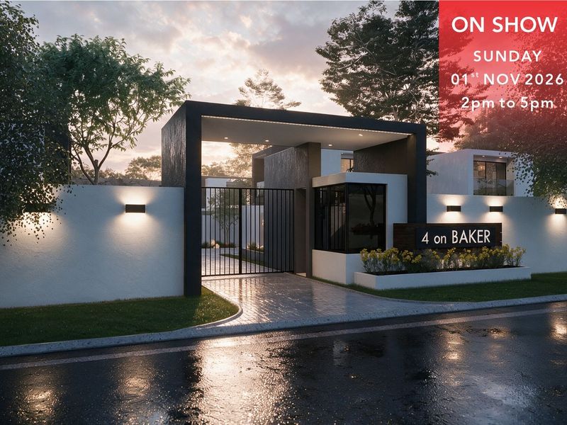 Modern residential complex entrance featuring a sleek security gate, perimeter wall, and contemporary architectural lighting at 4 on Baker.