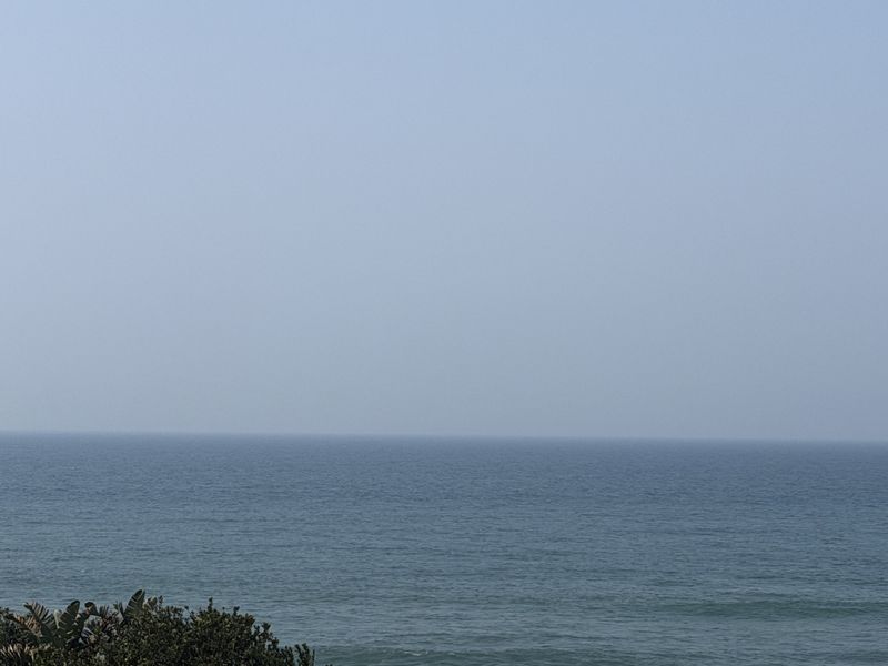 A clear, expansive view of the ocean horizon.